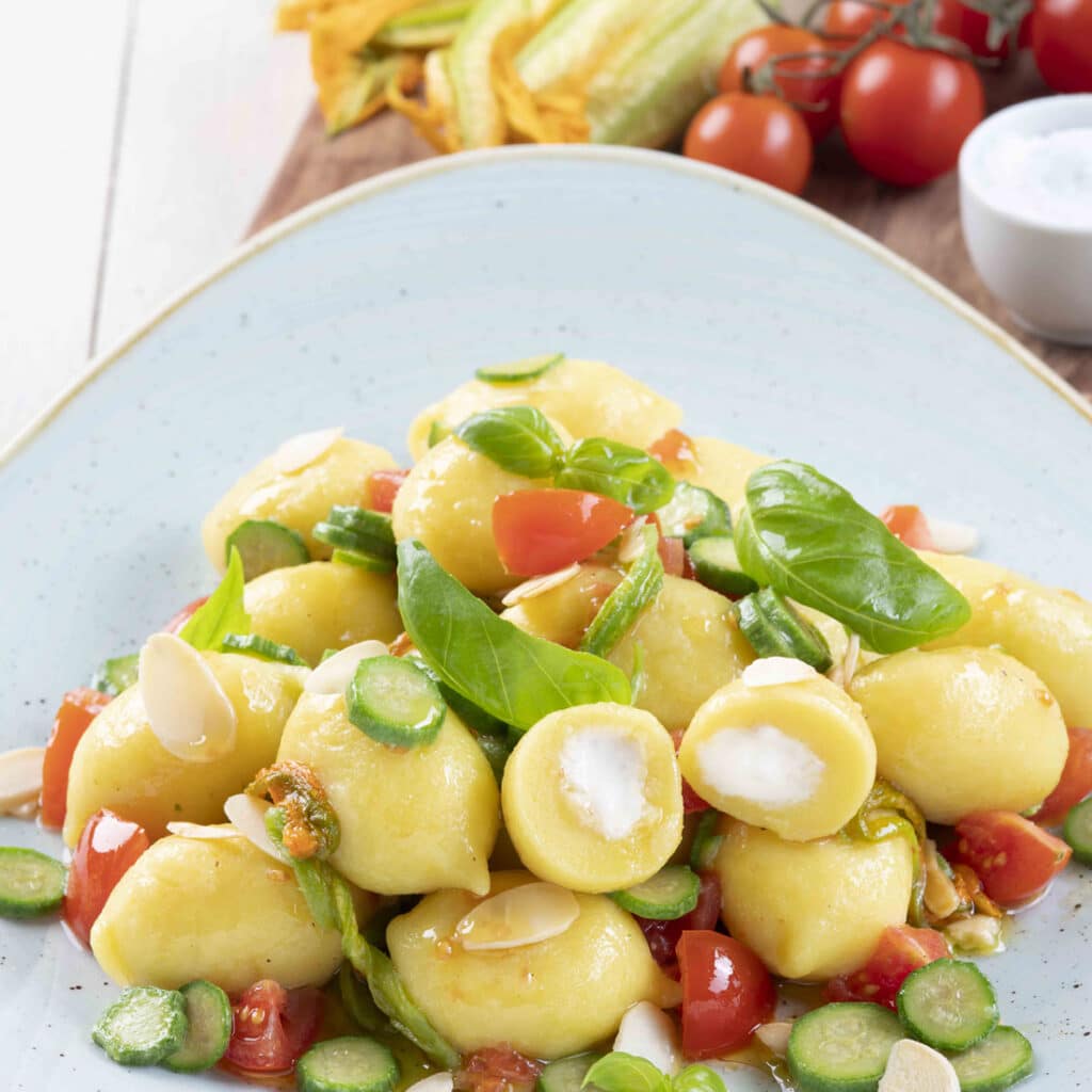 Italian Cheese Stuffed Gnocchi with Courgettes in Bloom, Fresh Tomato and Basil